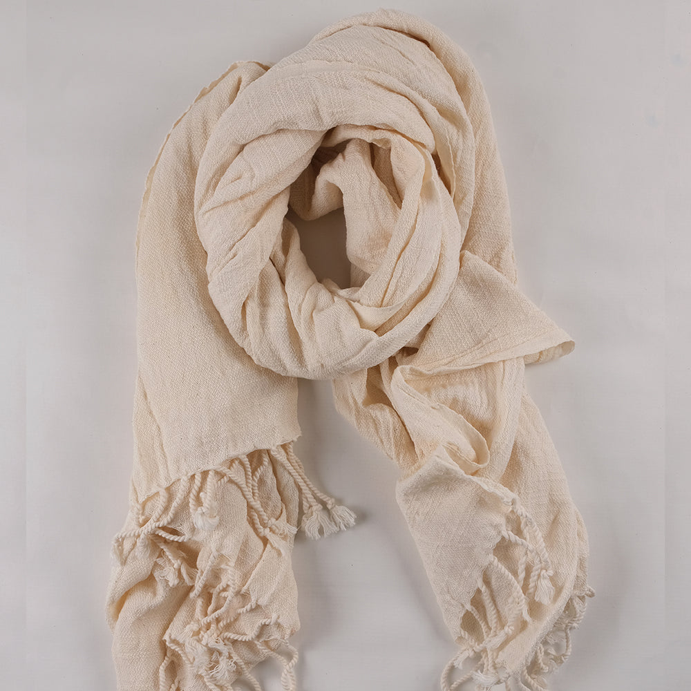 The 100% cotton crinkle shawl beautifully presented on a white surface.