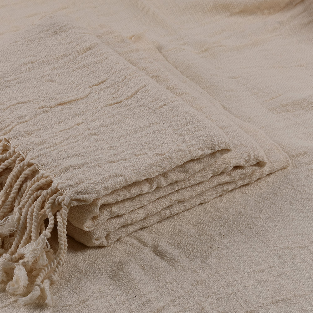 The 100% cotton crinkle shawl neatly folded, highlighting its texture and quality.