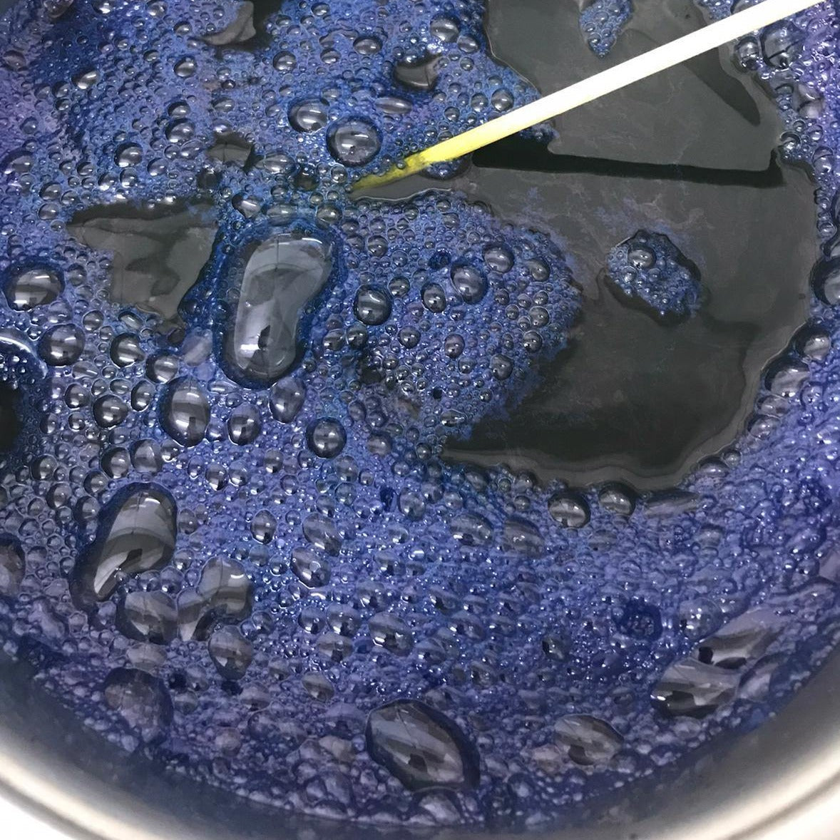 Indigo reduction vat prepared with Natural Indigo Extract for vat dyeing and oxidation.