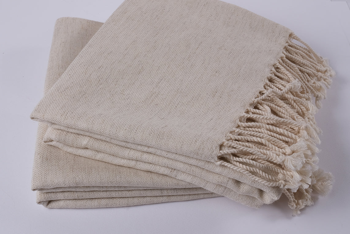 Handwoven undyed peshtemal towels folded together, natural cotton linen fabric