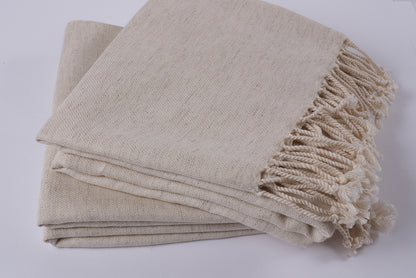 Handwoven undyed peshtemal towels folded together, natural cotton linen fabric