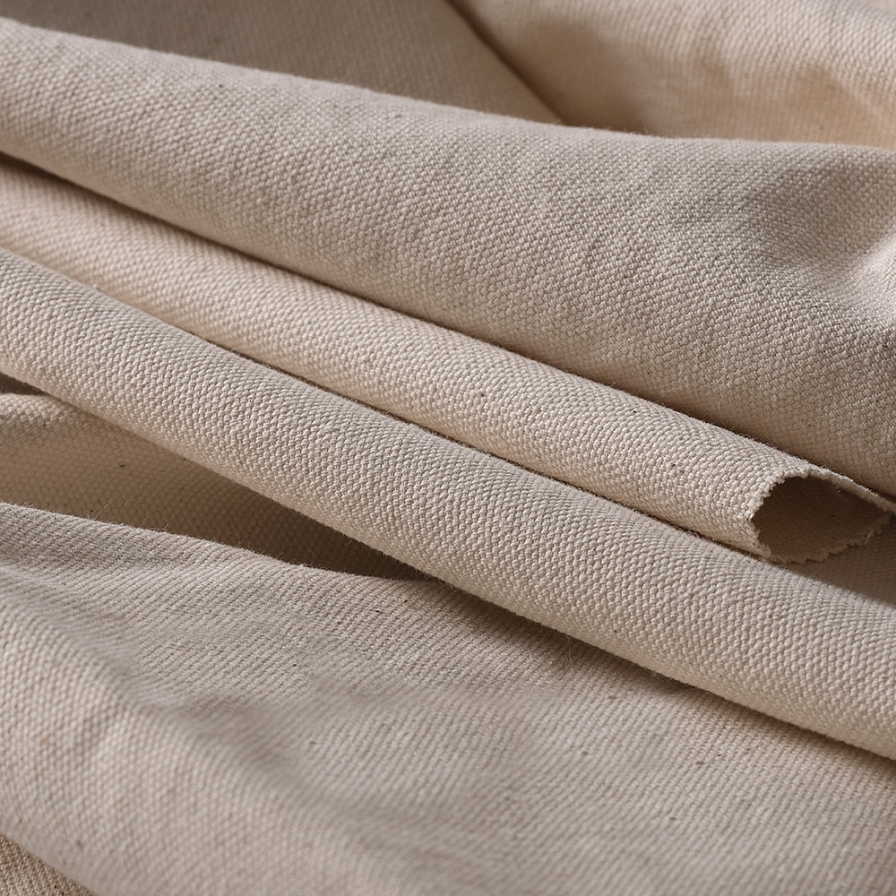 Close-up texture of untreated cotton canvas fabric suitable for natural dyeing, printing, and craft use