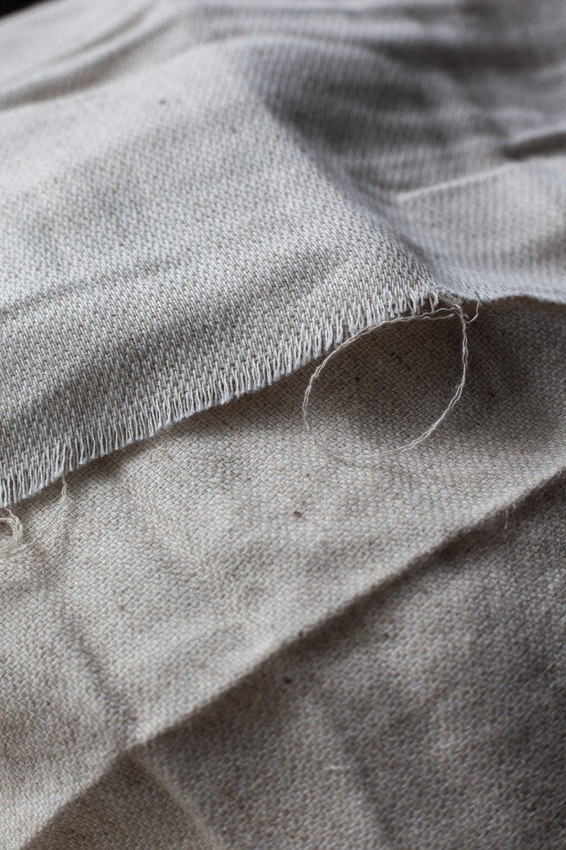 Raw edge detail of undyed linen cotton fabric, unfinished and untreated for natural dyeing